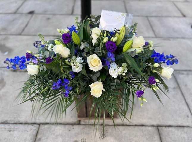 Blue and white coffin spray